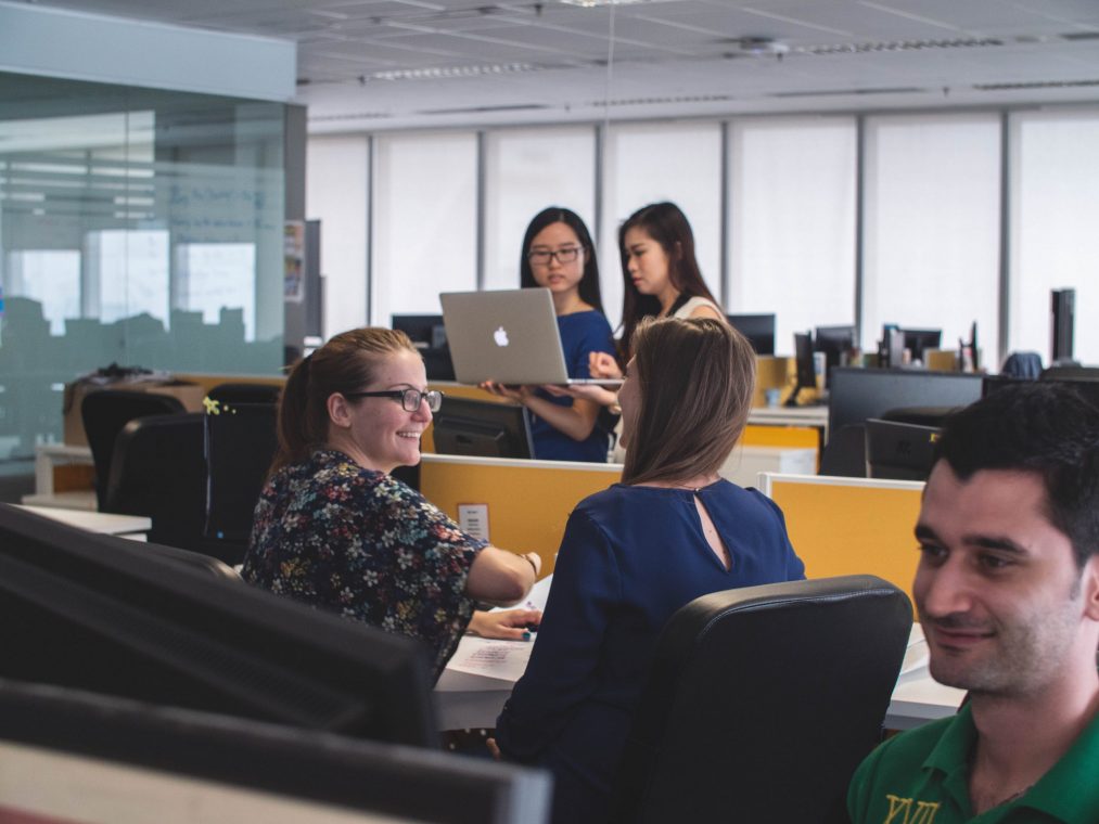 estate agents discussing in an office how to reach their goals