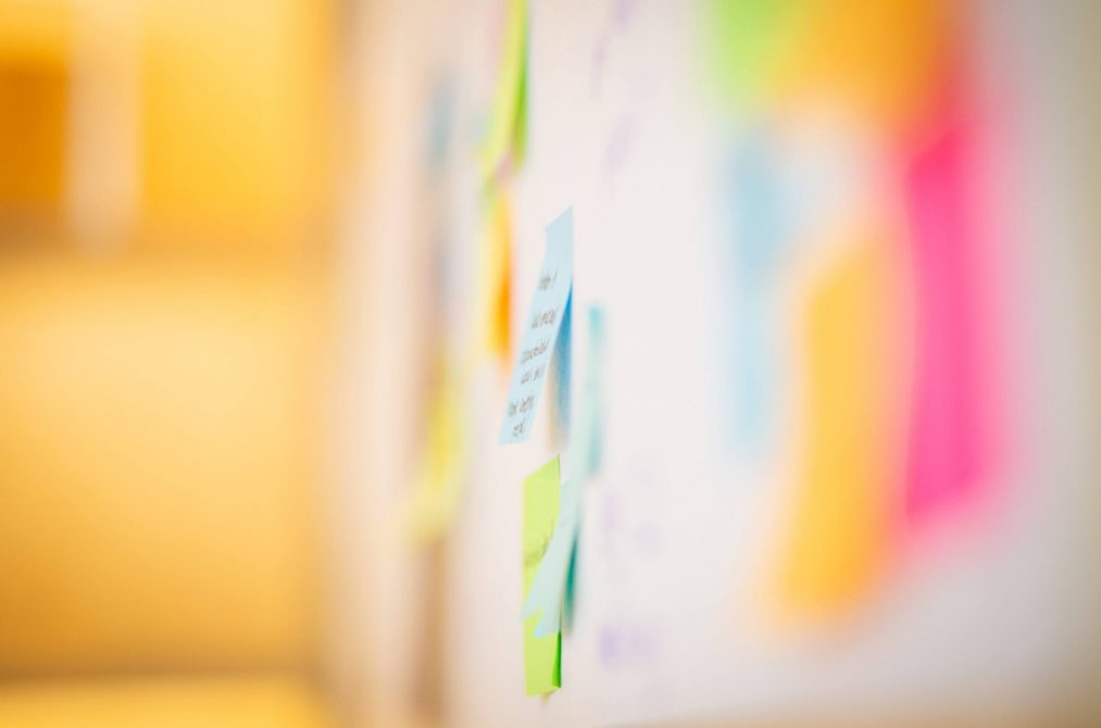post-it notes on a whiteboard with ideas about marketing