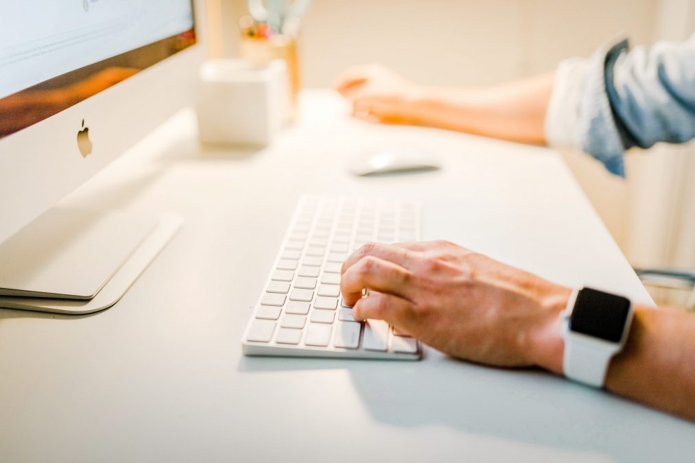 Propertystream employee typing at a desktop