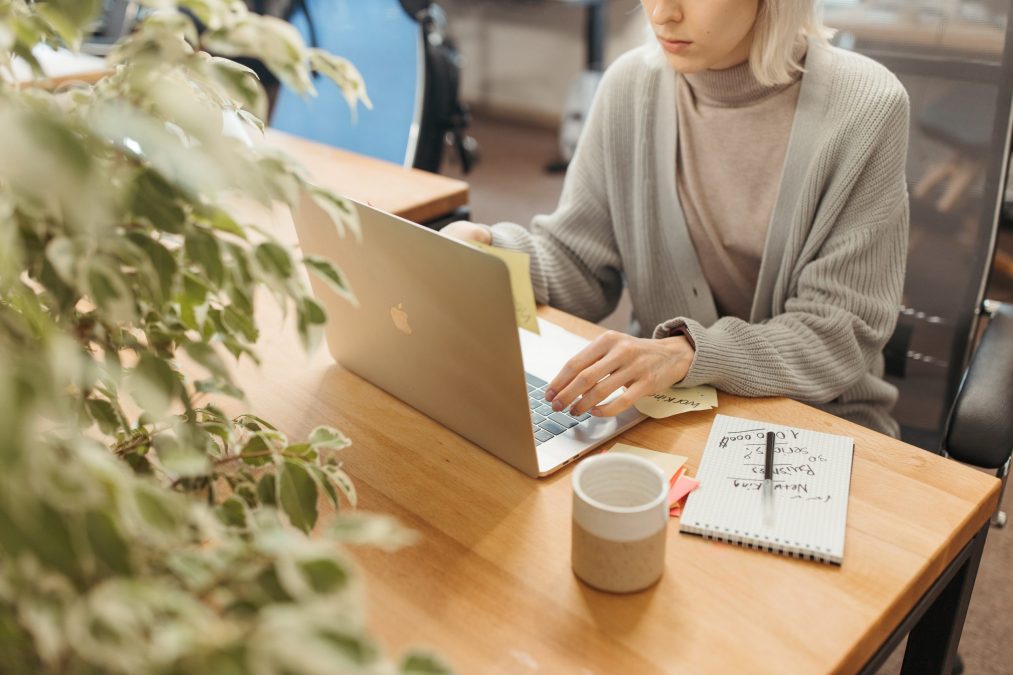 lady at her laptop making notes