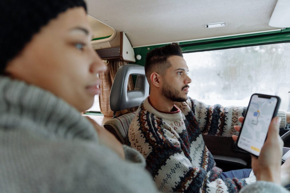 two people using google maps to direct them in a car