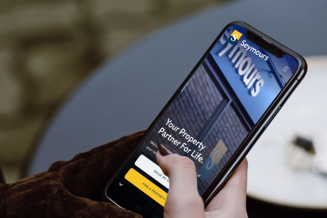 Strong estate agency brand Seymours in Surrey shown on a mobile phone, design by PropertyStream
